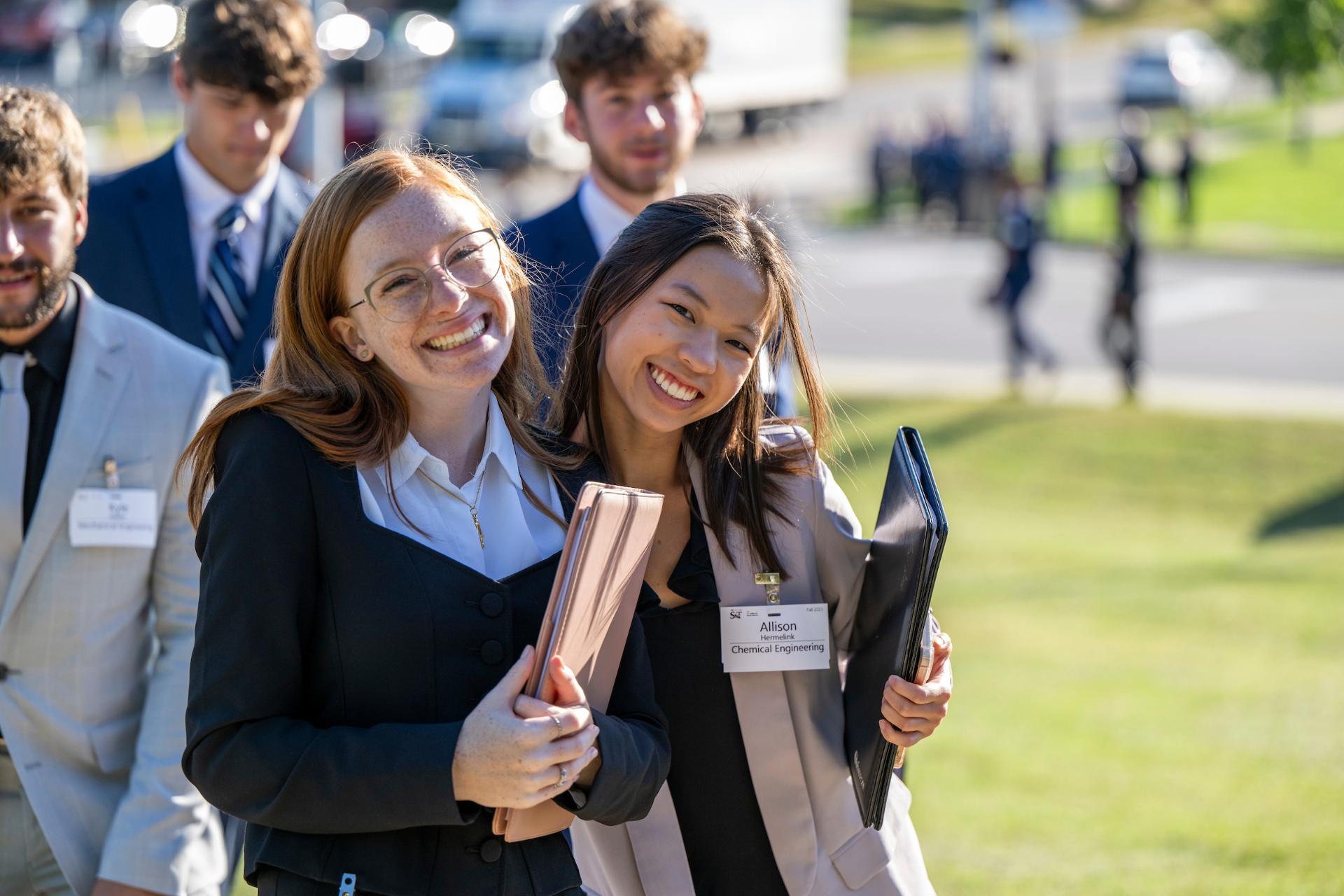 students excitedly walking to career fair